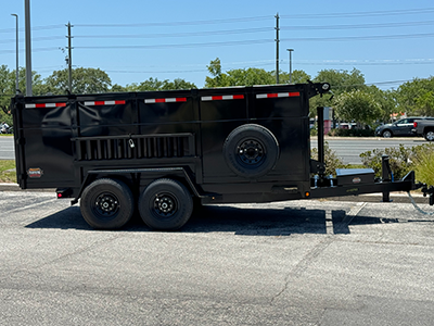 Dumpster parked in parking lot.